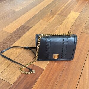 black leather shoulder bag weave detail with chain strap